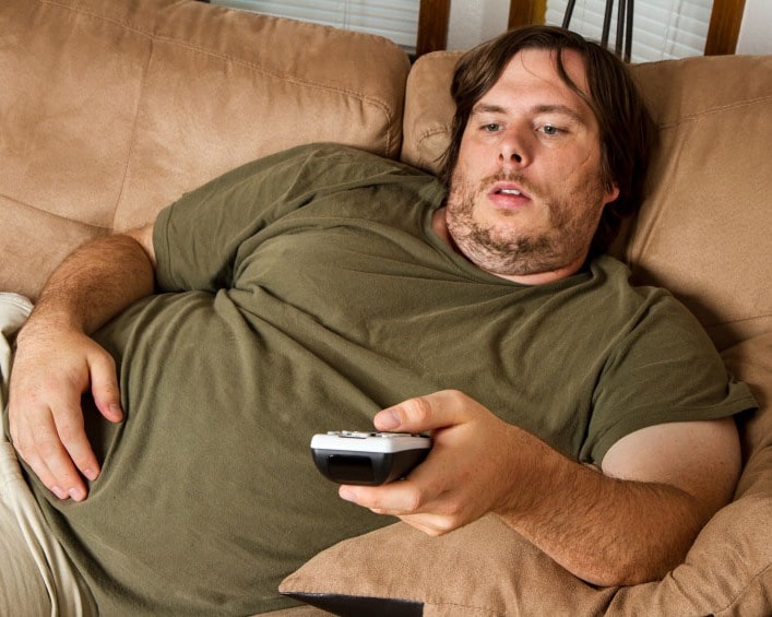 Fat lazy guy on the couch